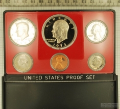 1973 US coin proof set sealed in hard plastic with a red matte background