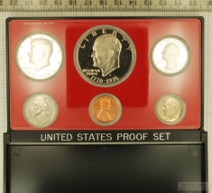 1976 US coin proof set sealed in hard plastic with a red matte background