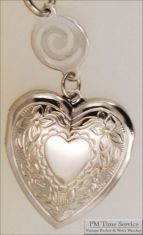 Silver-toned heart shaped locket with floral engraving & round connector with a swirl design