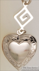 Silver-toned heart shaped locket with delicate engraving & Greek key geometric pattern connector