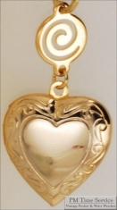Gold-toned heart shaped locket with delicate engraving & round connector with a swirl design