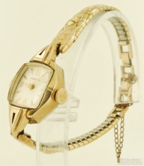 Caravelle by Bulova 15J ladies' wrist watch, fancy oval YBM & SS case with smooth polish sides