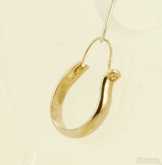 WGP single hoop style earring with simple oblong band of smooth polish WGP in a horse-shoe shape