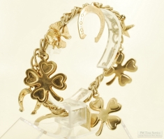 Vintage 7.5" YGP oval-link bracelet with multiple YGP heart, star, horseshoe & 4-leaf clover charms