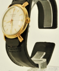 Hallmark 25J wrist watch, water resistant YGF & SS case, champagne-toned metal dial, leather band