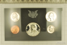 1970 US coin proof set sealed in hard plastic with black matte background, original outer cover