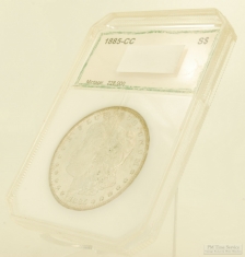1885-CC Morgan $1 silver coin, previous grade MS63, sealed in a PCI protective sleeve