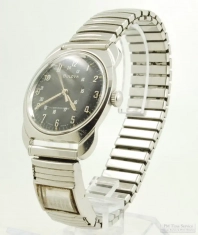 Bulova 17J wrist watch, cushion-shaped SS thin-model WR case, Canadian dial, perpetual calendar band