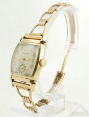 Bulova 15J grade 10AX wrist watch, YGF & SS tonneau-shaped case with fancy lugs, bracelet style band