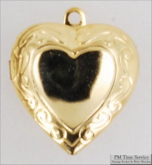 Gold-toned heart shaped locket with delicate engraving