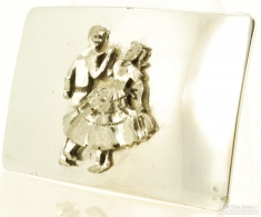 Vintage WBM belt buckle with a raised center elaborate design of a square dancing couple