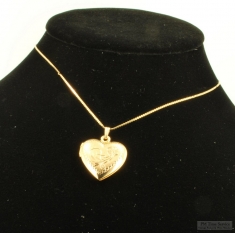 YGP heart-shaped locket with a matching 15.5" serpentine-link necklace, elaborate engraved flower